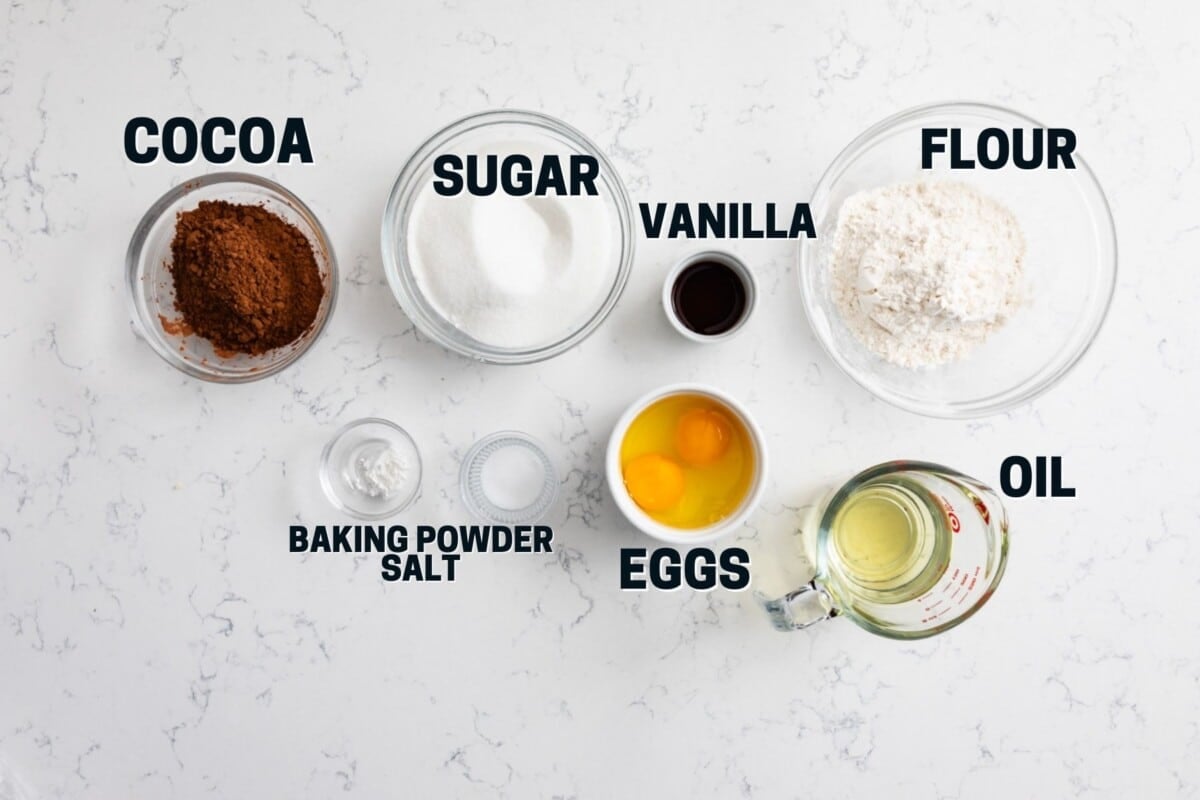 ingredients in brownie cupcakes on marble counter with words on photo