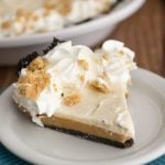 slice of peanut butter cookie dough cheesecake pie on white plate