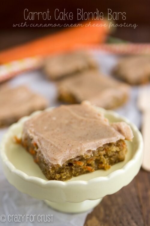 Carrot cake blondie bar in a white dish with words