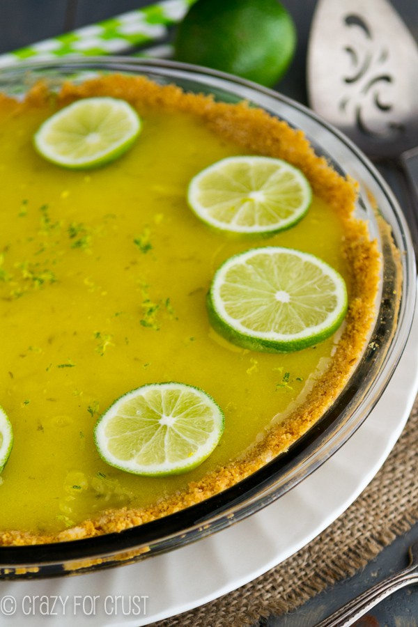 Close up of key lime pie in a glass pie dish