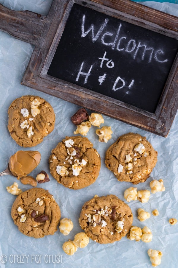 Overhead shot of Moose Munch Peanut Butter Cookies and a wooden chalkboard sign that says Welcome to H&D!