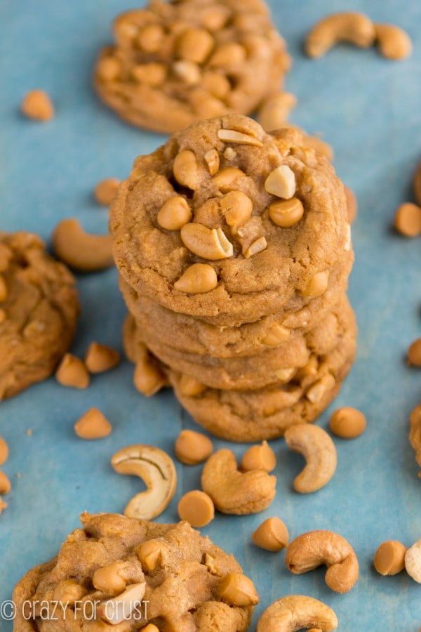 butterscotch pudding cookies stacked on blue paper