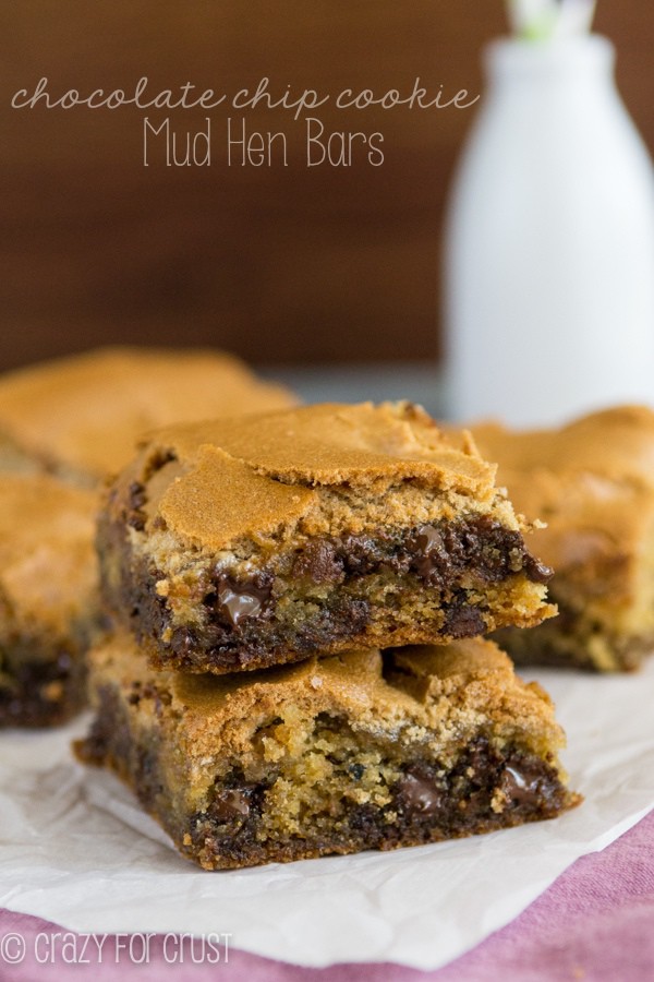 Chocolate Chip Cookie Mud Hen Bars Recipe - melty chocolate chip cookie topped with a brown sugar meringue sitting on parchment paper