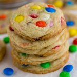 M&M Sugar Cookies stacked on top of each other with M&Ms spread around