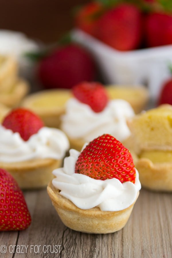 Mini Strawberry Shortcake Pies on a wooden board