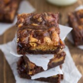 Peanut Butter and Jelly Brownies stacked on parchment paper