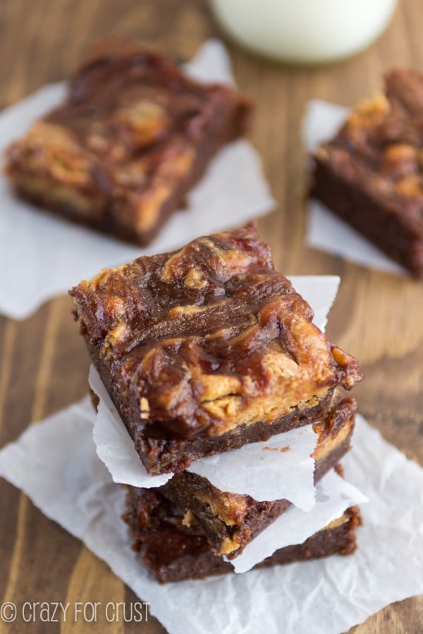 Stack of PB&J Brownies on parchment paper