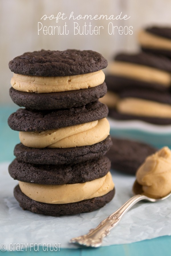 Soft batch Homemade Peanut Butter Oreos stacked on top of each other with spoonful of peanut butter