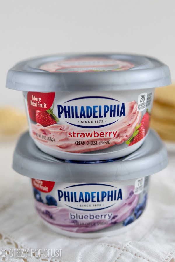 Philadelphia strawberry and blueberry cream cheese stacked on top of each other 