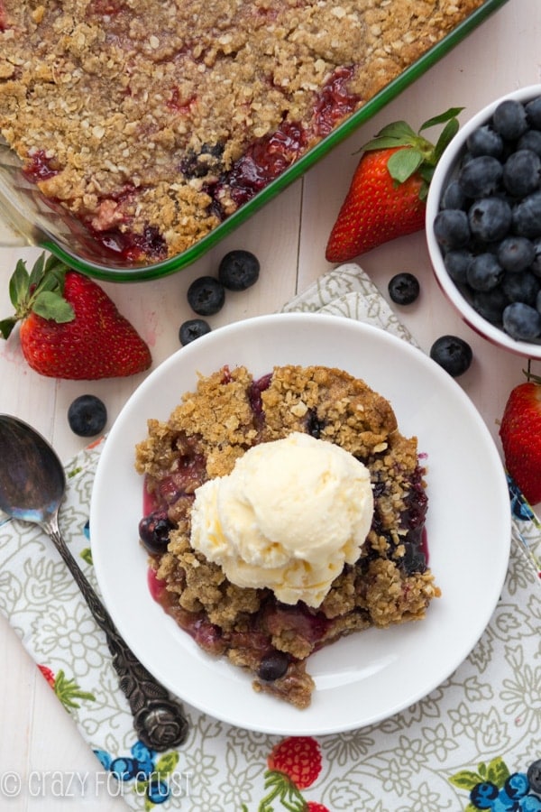 Berry Crisp with Oatmeal Cookie Crumble over head on a white plate 
