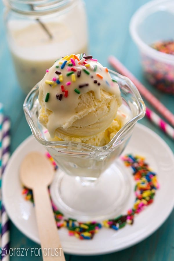 DIY Homemade Birthday Cake Magic Shell on vanilla ice cream in a ice cream bowl with sprinkles all around