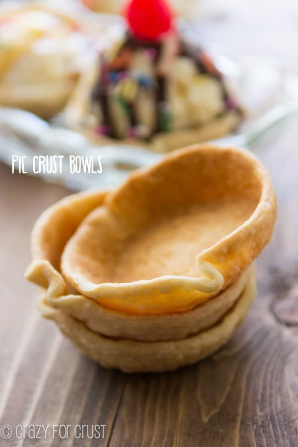 Pie crust Bowls stacked on top of each other on a brown board 