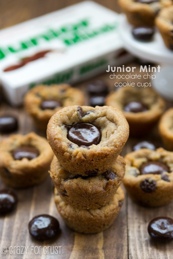 Junior Mint Chocolate Chip Cookie Cups stacked on top of each other with Junior mints box in the background 