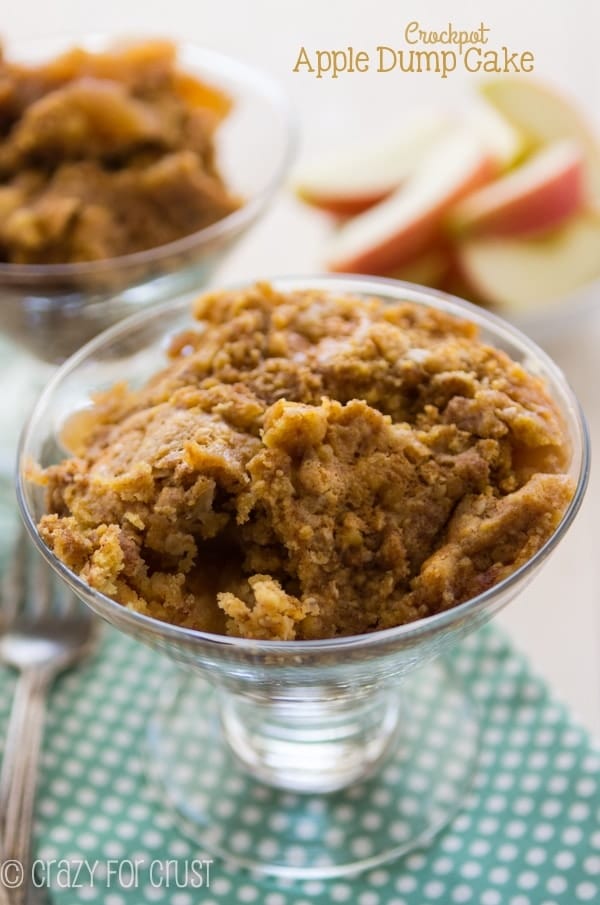 Crockpot apple dump cakes in a glass bowl with title.