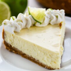 slice of key lime cheesecake on white plate
