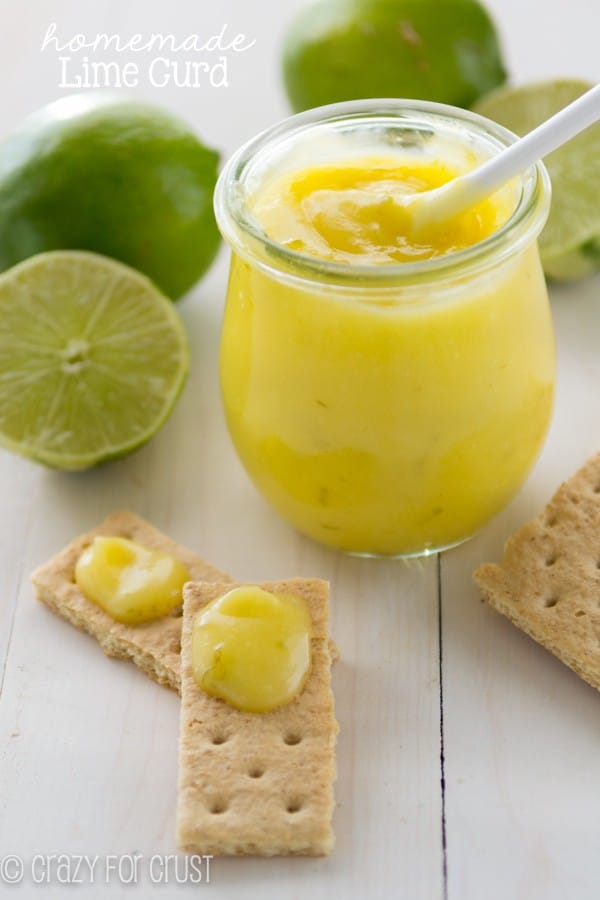 Homemade Lime Curd in small clear glass and 2 graham cracker with the Lime curd on them 