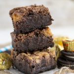 Stack of Peanut Butter Cup Brownies with Oreo Crust