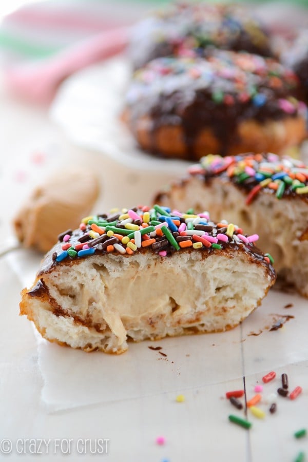 Peanut Butter Cream Doughnuts - easy fried doughnuts filled with peanut butter and topped with chocolate glaze!