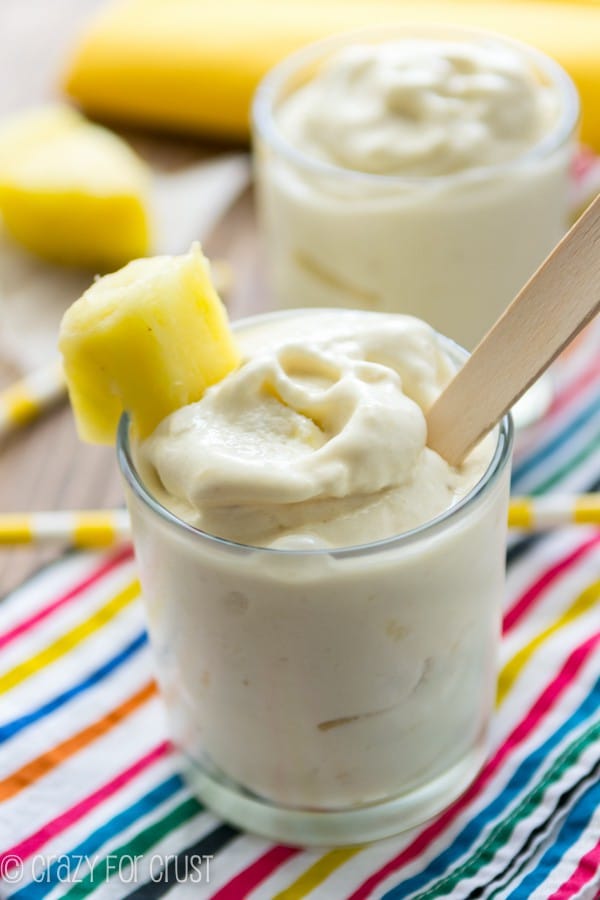 Copycat Pineapple Whip in short clear glass on rainbow towel