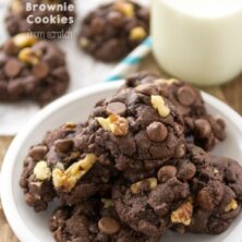 chocolate cookies with nuts on white plate