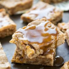blondies in a stack with caramel drizzled over