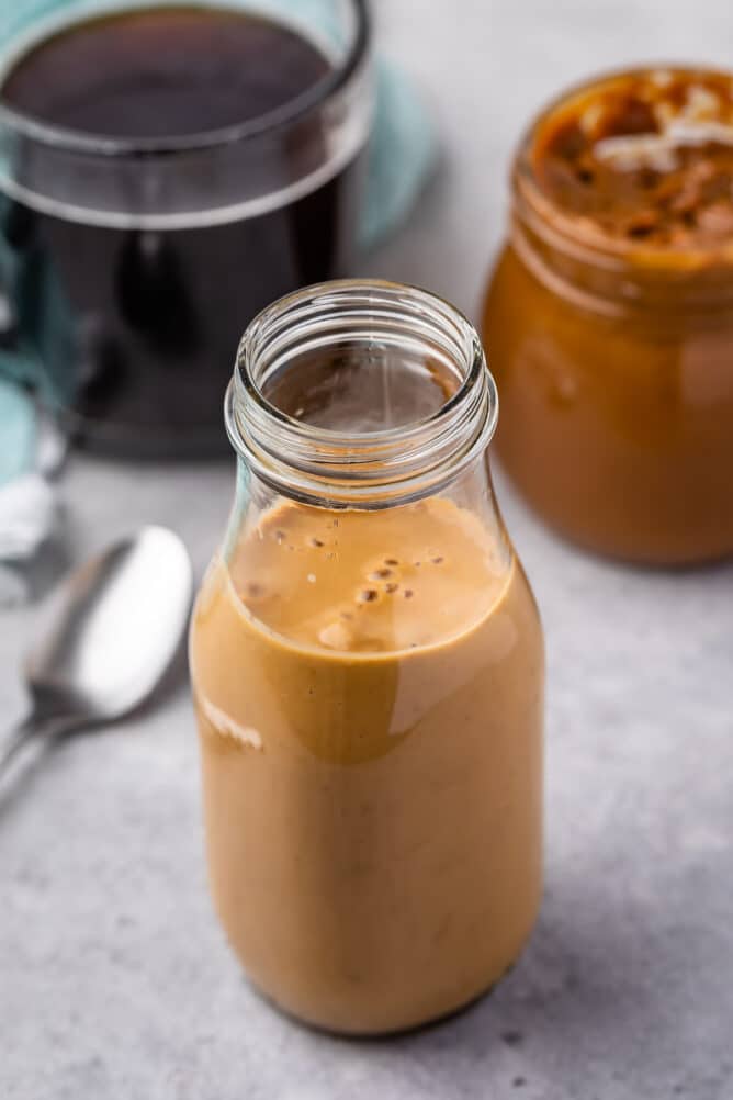 creamer in jar with coffee behind