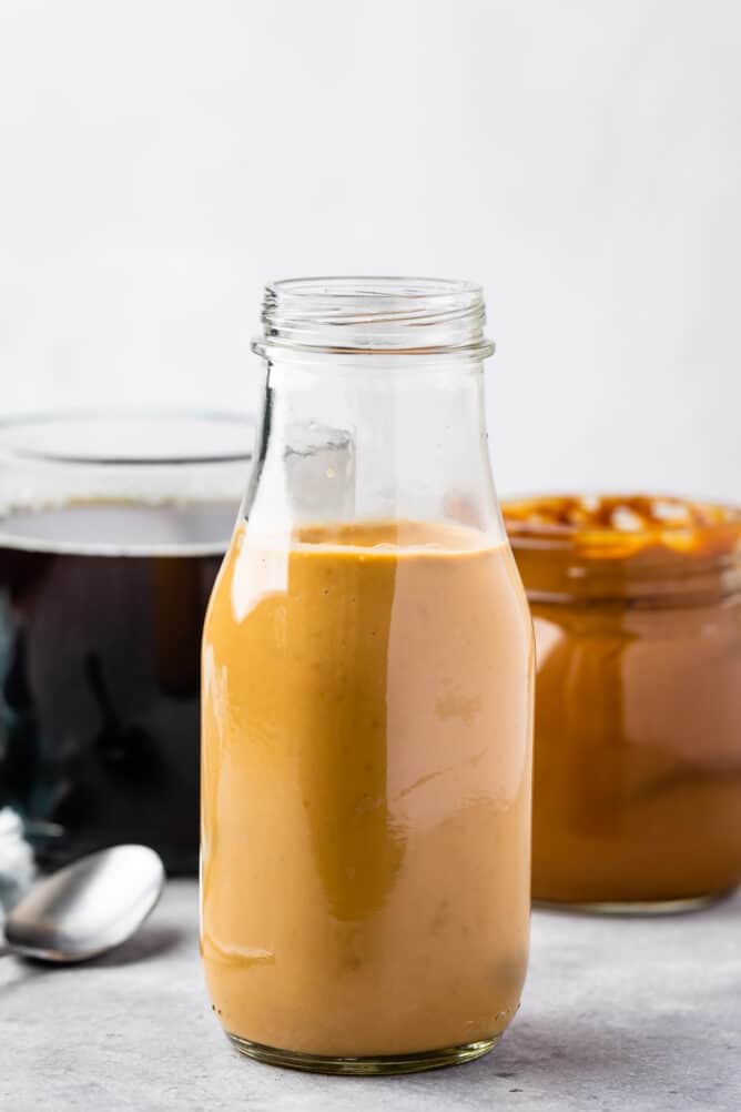creamer in jar with coffee behind