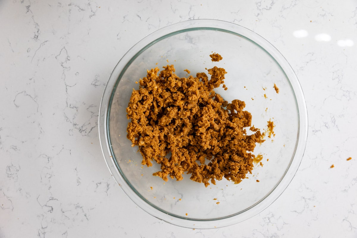 butter sugar and peanut butter creamed in clear bowl