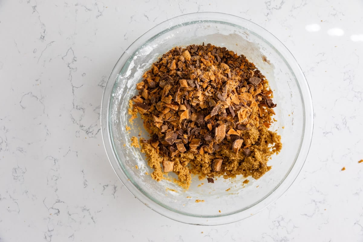 blondie mixture in bowl with butterfinger pieces