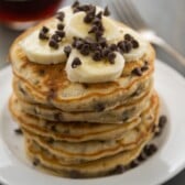 stack of banana pancakes with bananas and chocolate chips