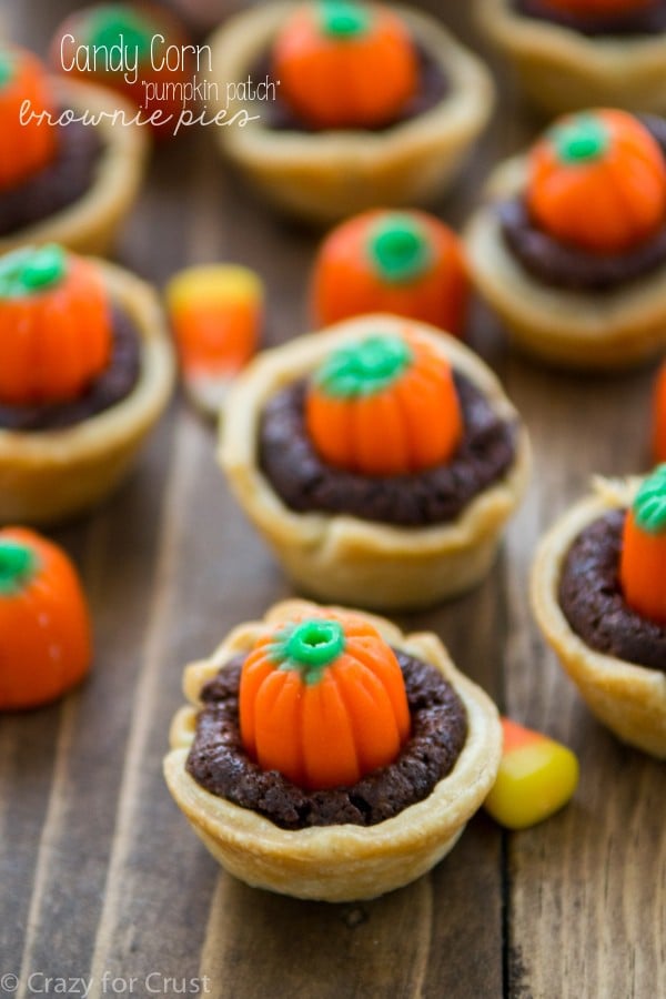 mini brownie pie with crust and candy pumpkin on top