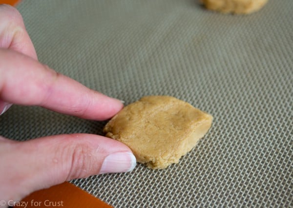 shaping cookie dough into peanut butter footballs