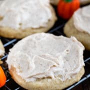 closeup of pumpkin spice sugar cookie with frosting