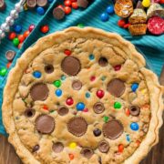 overhead shot of candy bar pie with candy behind