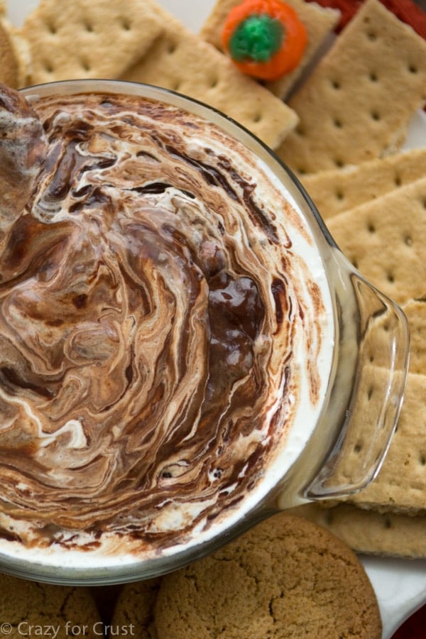 Pumpkin S'mores Dip has pumpkin pie, chocolate ganache, and marshmallow all in one warm dip!