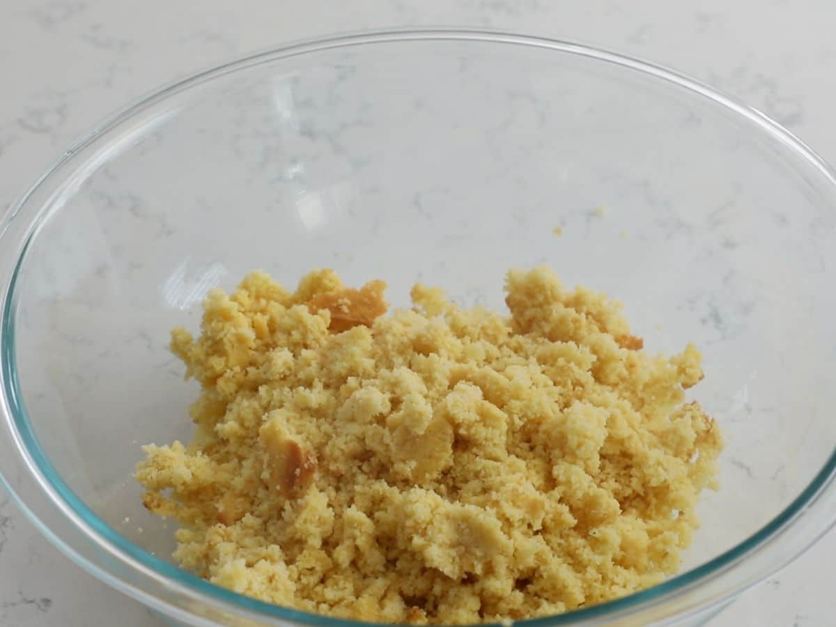 crumbled cornbread in large glass bowl.