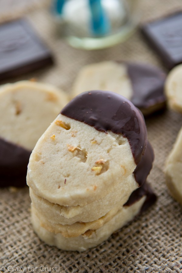Chocolate Dipped Ginger Shortbread Cookies - buttery cookies filled with lightly dried ginger and dipped in chocolate. And their easy to make because their slice and bake!