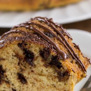 Healthier Chocolate Chip Cake on a white plate with a fork