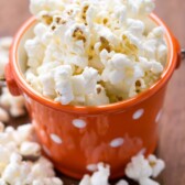 Skinny Sugar Free Kettle Corn in an orange and white polka dot cup