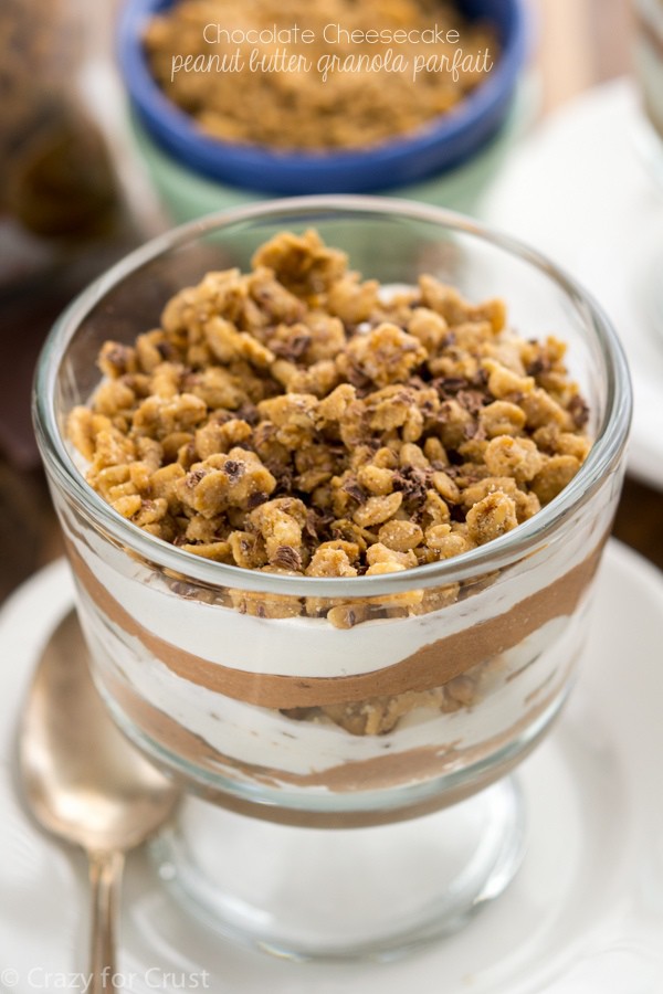 This Chocolate Peanut Butter Granola Parfait is the most indulgent way to eat granola! Layers of no bake chocolate cheesecake, whipped cream, and peanut butter granola make for one stunning dessert.