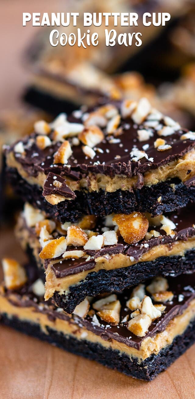 stack of peanut butter cup cookie bars with bite missing