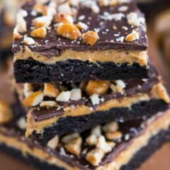 stack of peanut butter cup cookie bars with bite missing