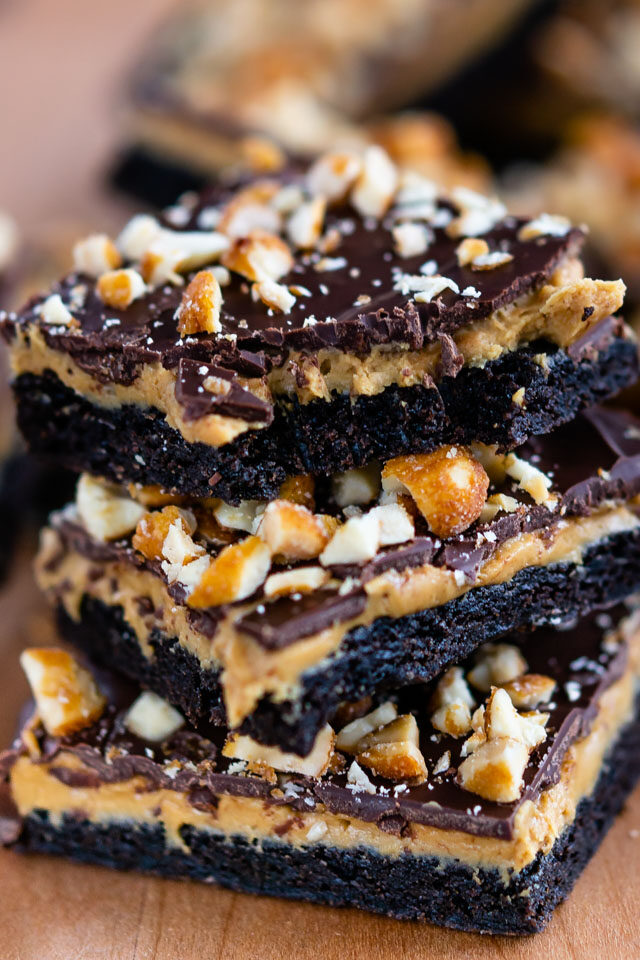 stack of peanut butter cup cookie bars with bite missing