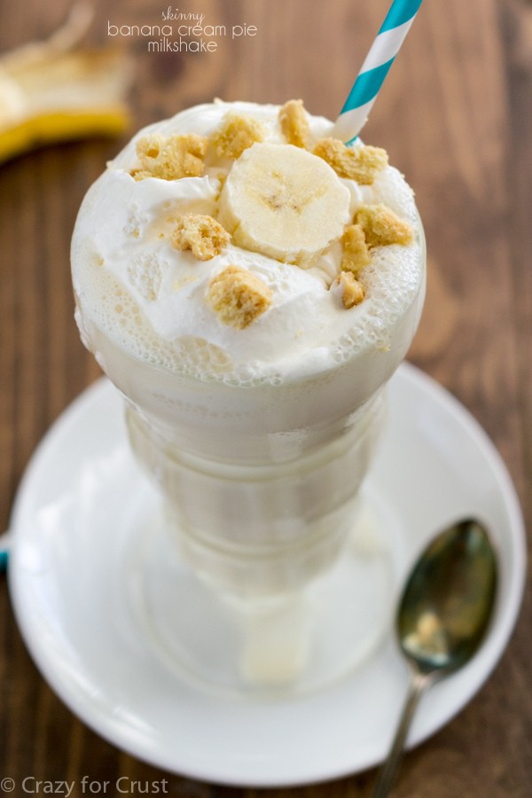 milkshake in tall glass on white plate