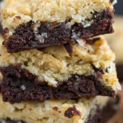 brownie layer with coconut cookies on top, stack of cookie bars