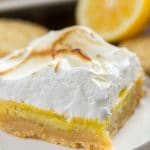 Slice of Lemon Meringue Pie Bars with Shortbread Crust on a white plate