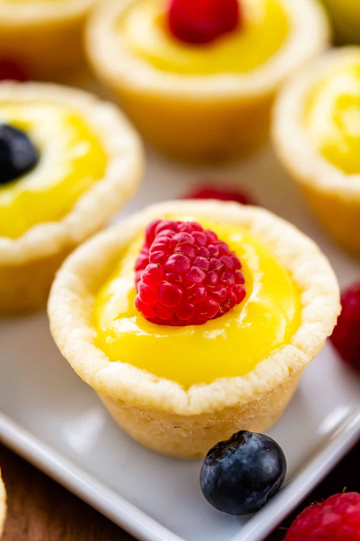 cookie cup with lemon curd and raspberry