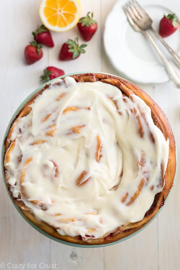 Giant Strawberry Cinnamon Roll Cake Recipe made with fresh strawberries and lemon cream cheese icing!