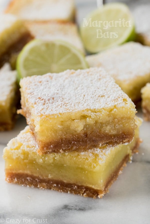 The BEST Margarita Bars! It's an easy lime bar recipe with a hint of tequila and a graham cracker crust!