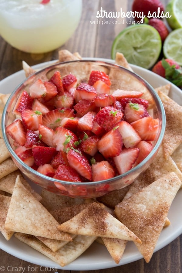 Strawberry Fruit Salsa with a hint of lime served with cinnamon sugar pie crust chips! This easy recipe is the perfect appetizer or snack!